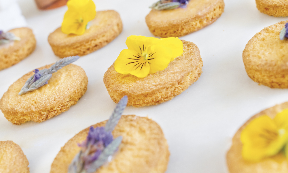 Flower-topped shortbread cookies photographed for Tiense Suiker