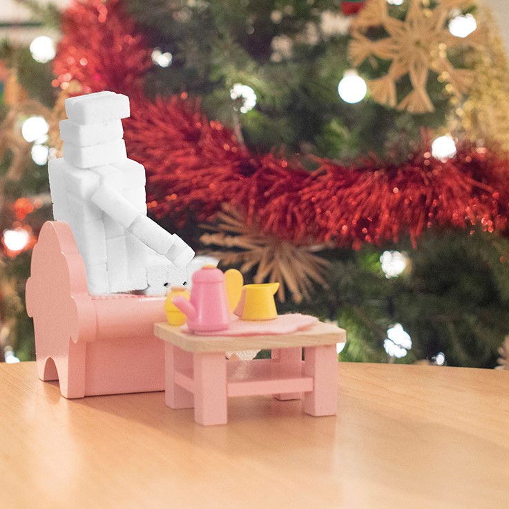 T-Man sugar character in a miniature Christmas scene